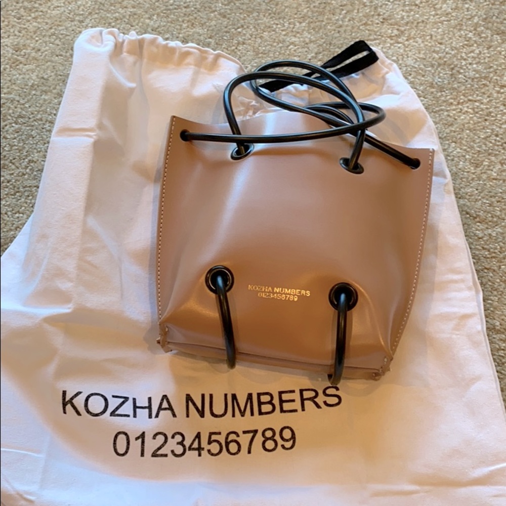 Kozha Numbers small utility bag. Nude.